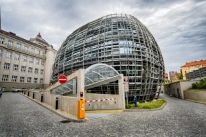 The glass-domed IOCB Prague building seen from the street