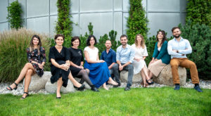 The Cahová group in 2020, sitting on a low wall on the lawn outside the institute